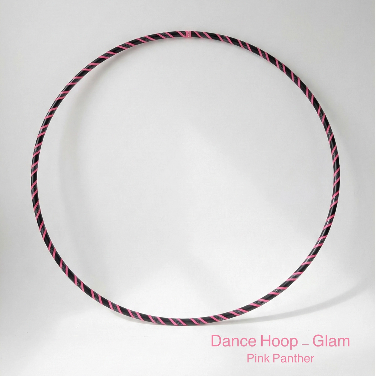 Dance hula hoop – Pink Panther Glam Edition. Professional black tubing featuring a reflective sequin black and fluoro pink grip tape spiral design for dance and fitness.