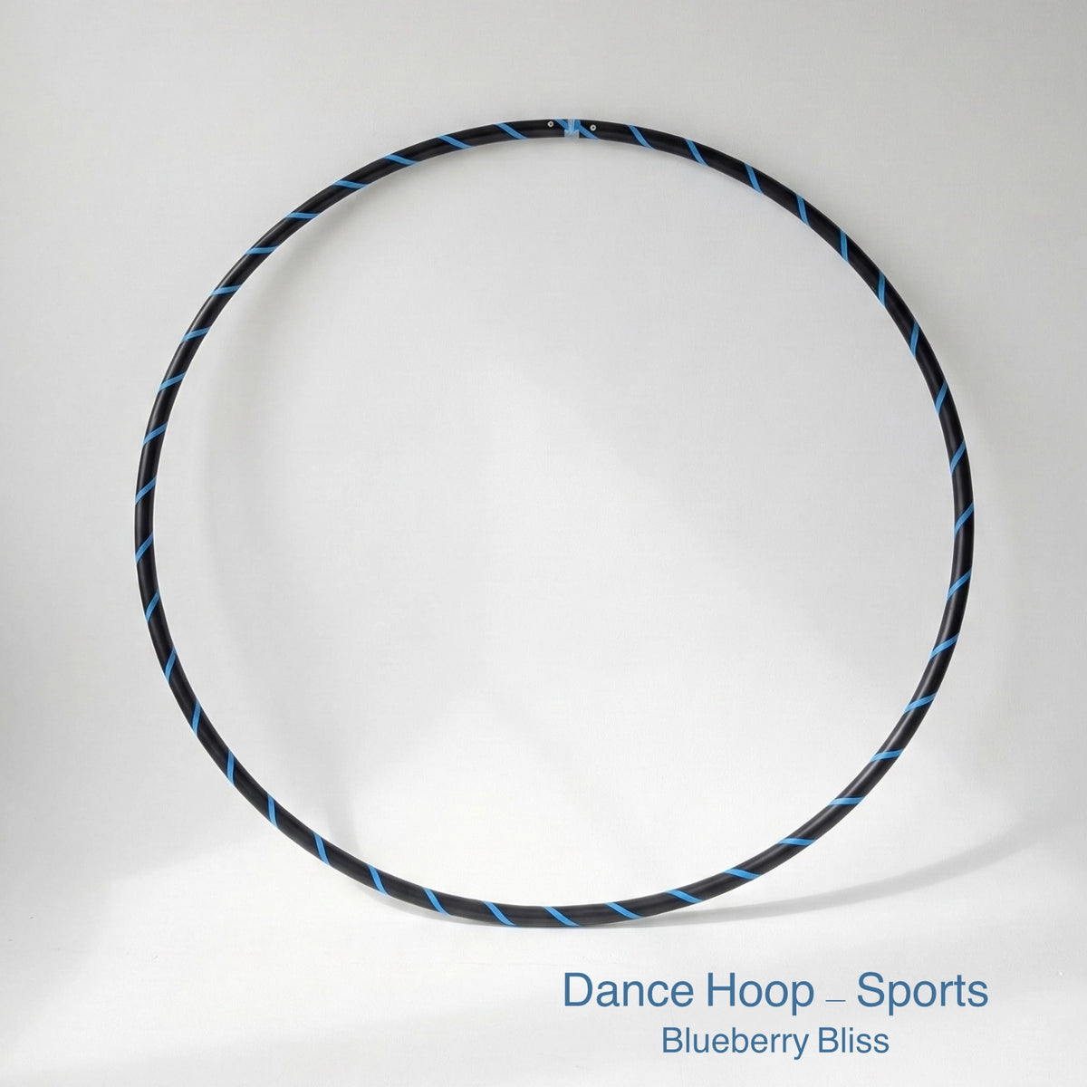 Dance hula hoop – Blueberry Bliss Sports Edition. Professional black tubing featuring a vibrant blue spiral tape design for dance and fitness.
