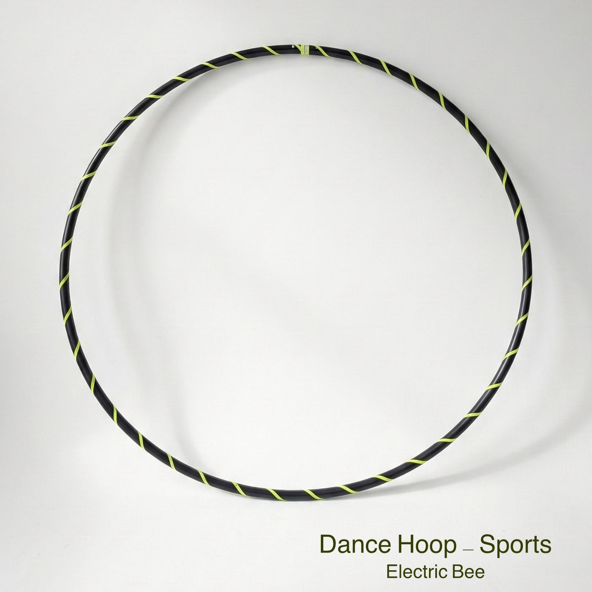 Dance hula hoop – Electric Bee Sports Edition. Professional black tubing featuring a UV-sensitive fluoro yellow spiral tape design.