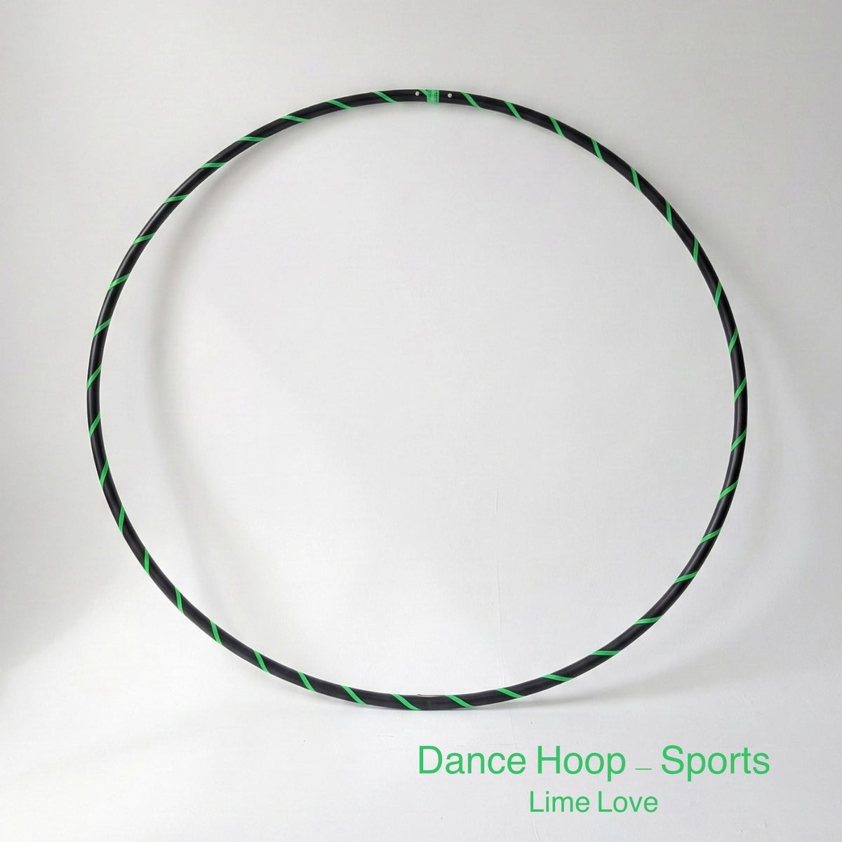 Dance hula hoop – Lime Love Sports Edition. Professional black tubing featuring a UV-sensitive fluoro green spiral tape design.