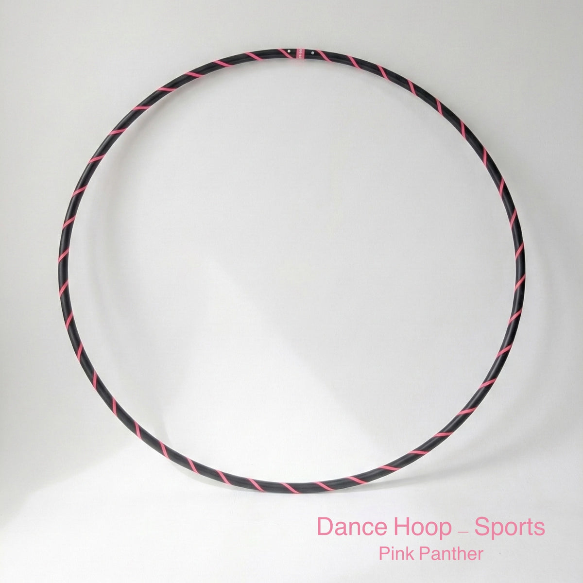 Dance hula hoop – Pink Panther Sports Edition. Professional black tubing featuring a UV-sensitive fluoro pink spiral tape design.