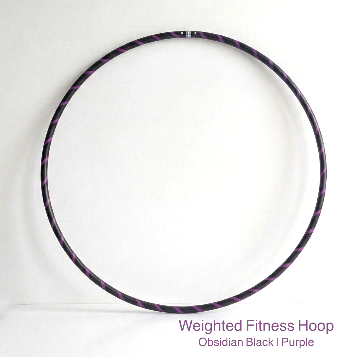 Weighted fitness hula hoop for adults in Obsidian Black sports model, featuring professional black tubing with a sleek purple spiral tape design.